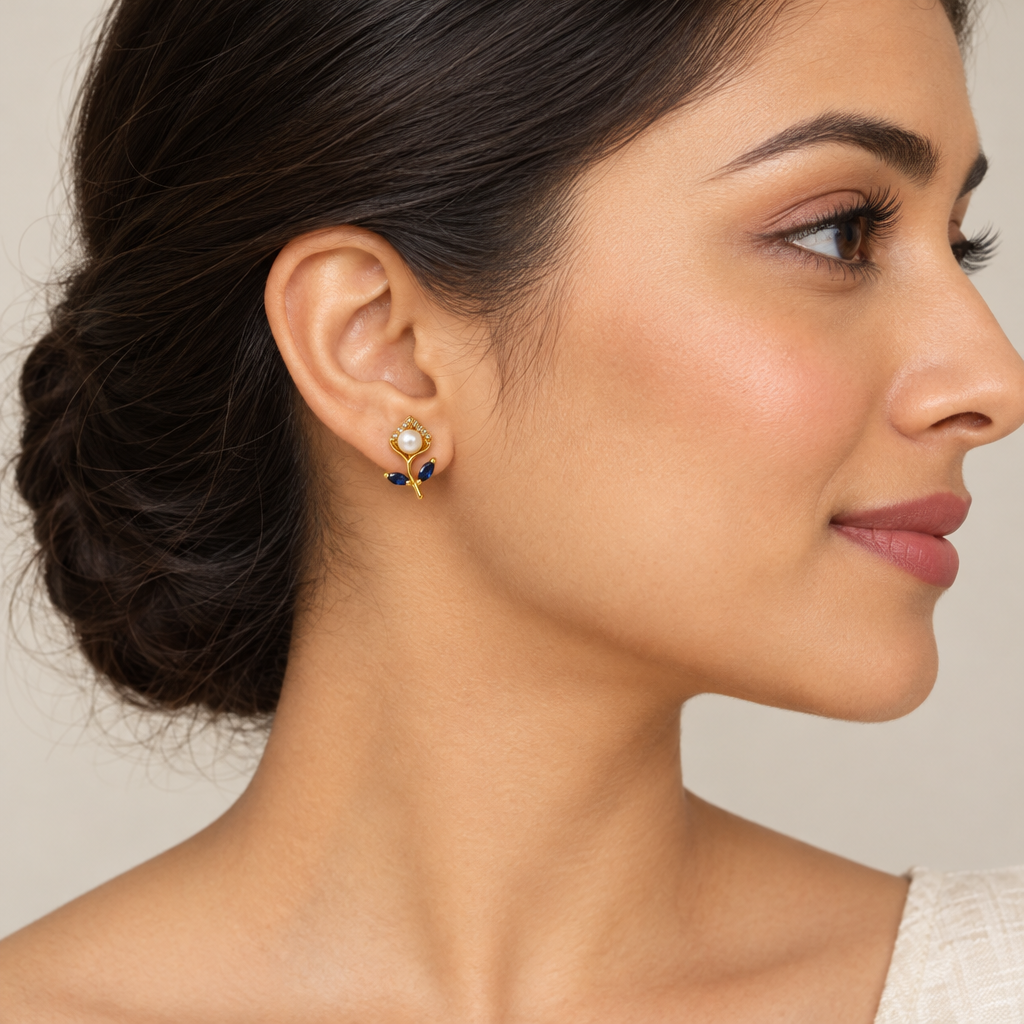 Model wearing blue pearl flower earrings