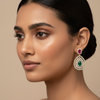 Model wearing delicate teardrop earrings