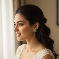 Model wearing pastel green fan-shaped earrings