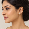 Model wearing purple pearl flower earrings
