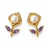 Purple pearl earrings on white background