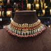 Ornate necklace with gemstones on a brown mannequin against a blurred jewelry background