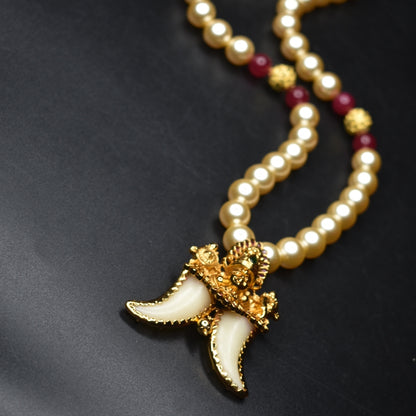 "Majestic Charm: Vintage Balaji Puligoru Pendant Adorned with Pearls"