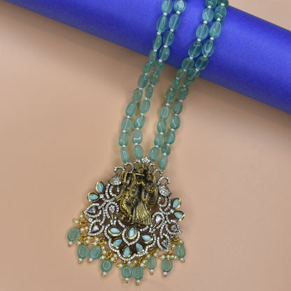 "Enchanting Elegance: The Pastel Green Radhakrishna Pendant Necklace - A Victorian-inspired Masterpiece with Beads Accents"