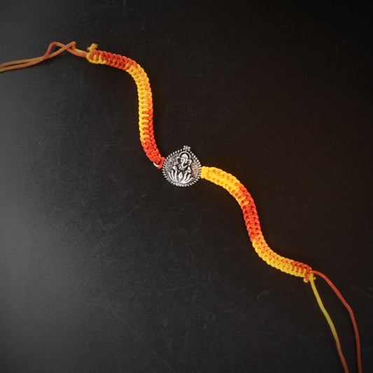 "Shimmering Blessings: 92.5 Silver Ganesh Rakhi - A Symbol of Divine Protection and Style"