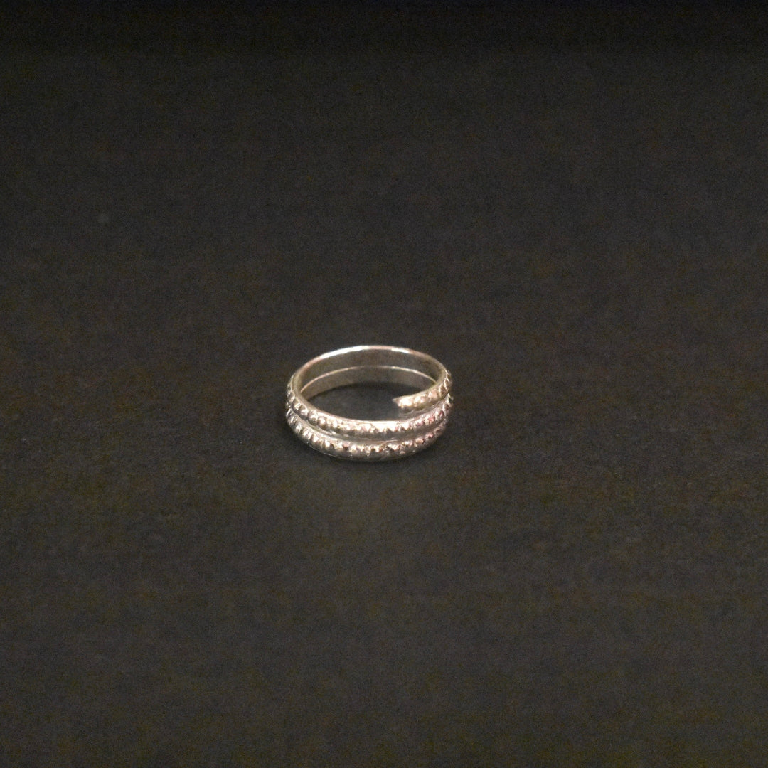 Silver ring on a dark textured background