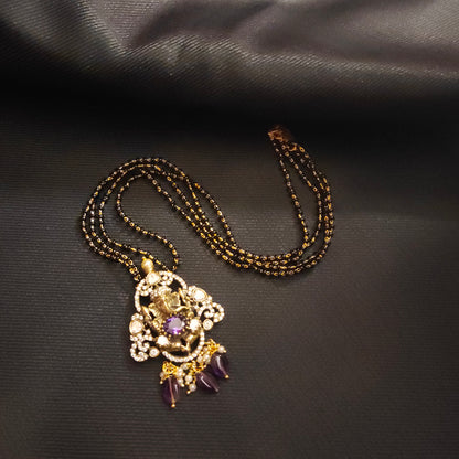 "Victorian Aura meets Divine Elegance: The Enchanting Ganesh Pendant Adorned with Black Beads Mangalsutra 36676559"