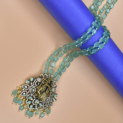 "Enchanting Elegance: The Pastel Green Radhakrishna Pendant Necklace - A Victorian-inspired Masterpiece with Beads Accents"