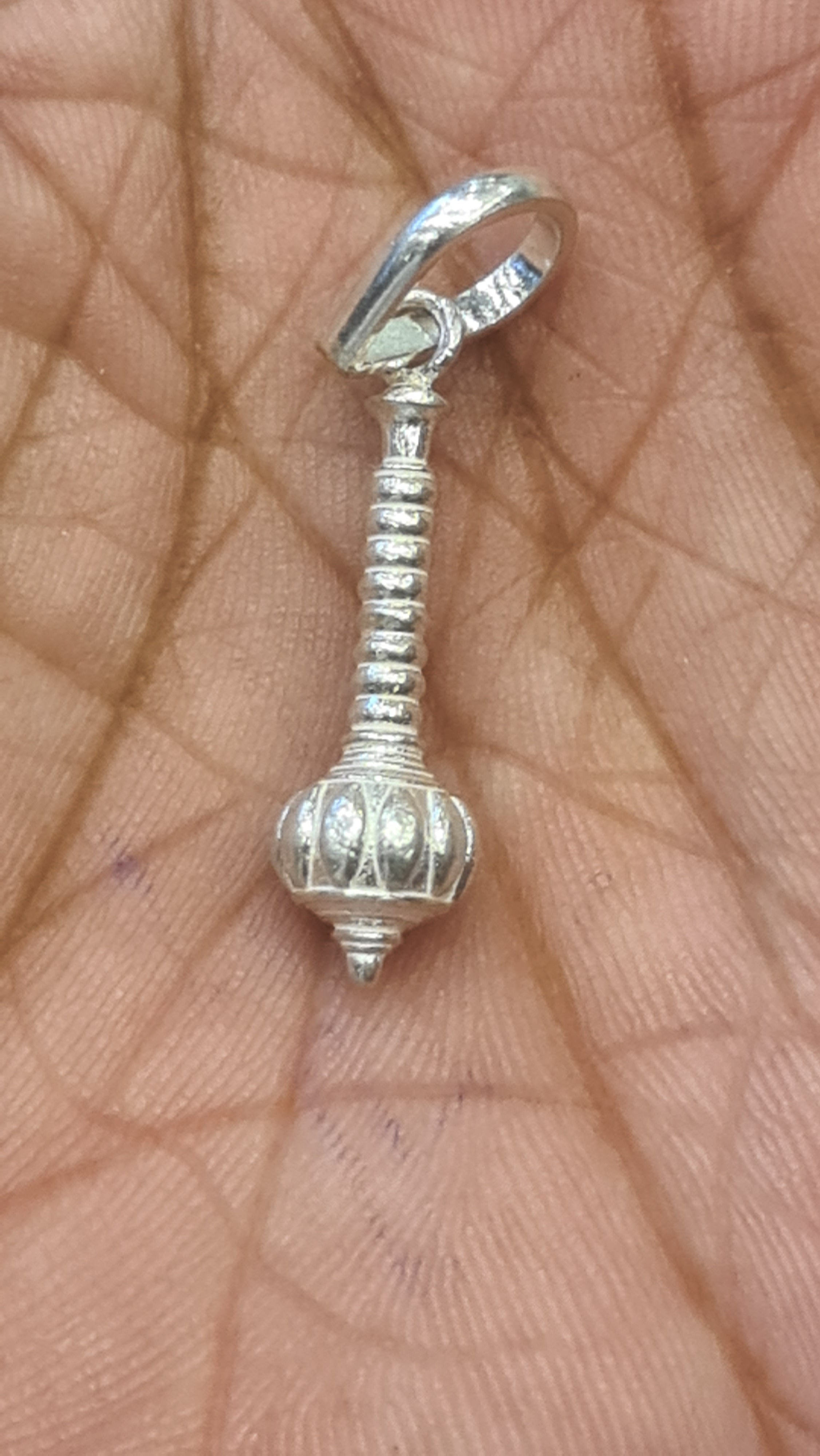 "Shine Bright: The Sacred Silver Hanuman Gada Locket"