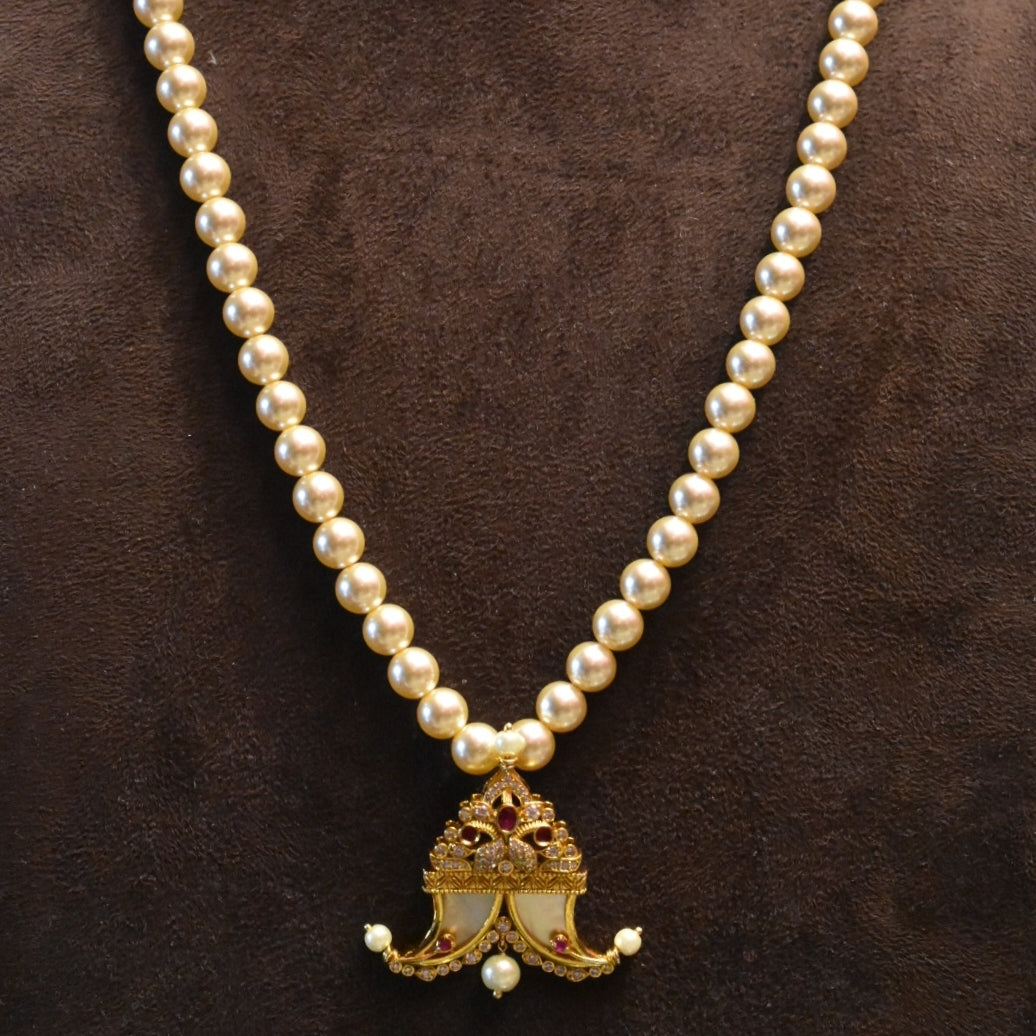 "Pearls of Elegance: Antique Finish Cz Puligoru Locket Necklace for Fashionable Kids"