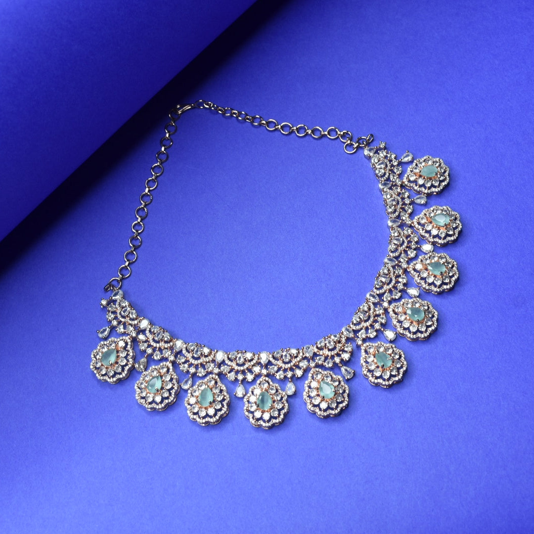 Rose Gold Plated Zircon Necklace Set displayed against a blue background
