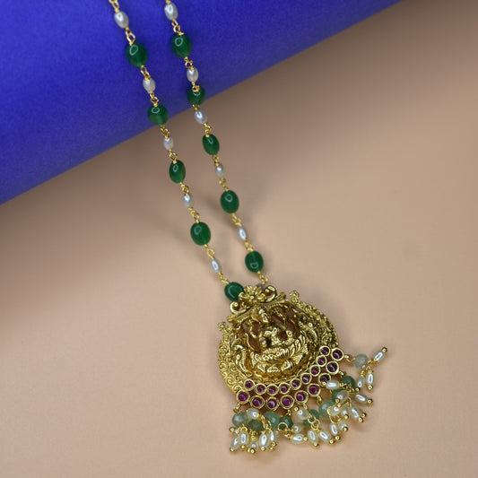 "Nagas Laxmi: A Regal Fusion of Elegance and Tradition in Emerald Beads Necklace"