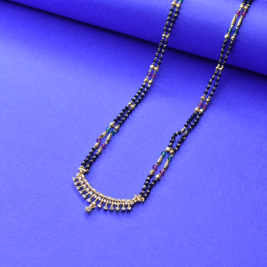 "Gleaming Elegance: The Exquisite Gold-Plated Mangalsutra Adorned with American Diamonds and Beads"