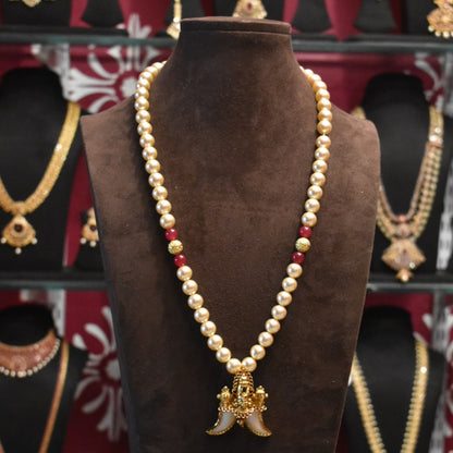 "Majestic Charm: Vintage Balaji Puligoru Pendant Adorned with Pearls"