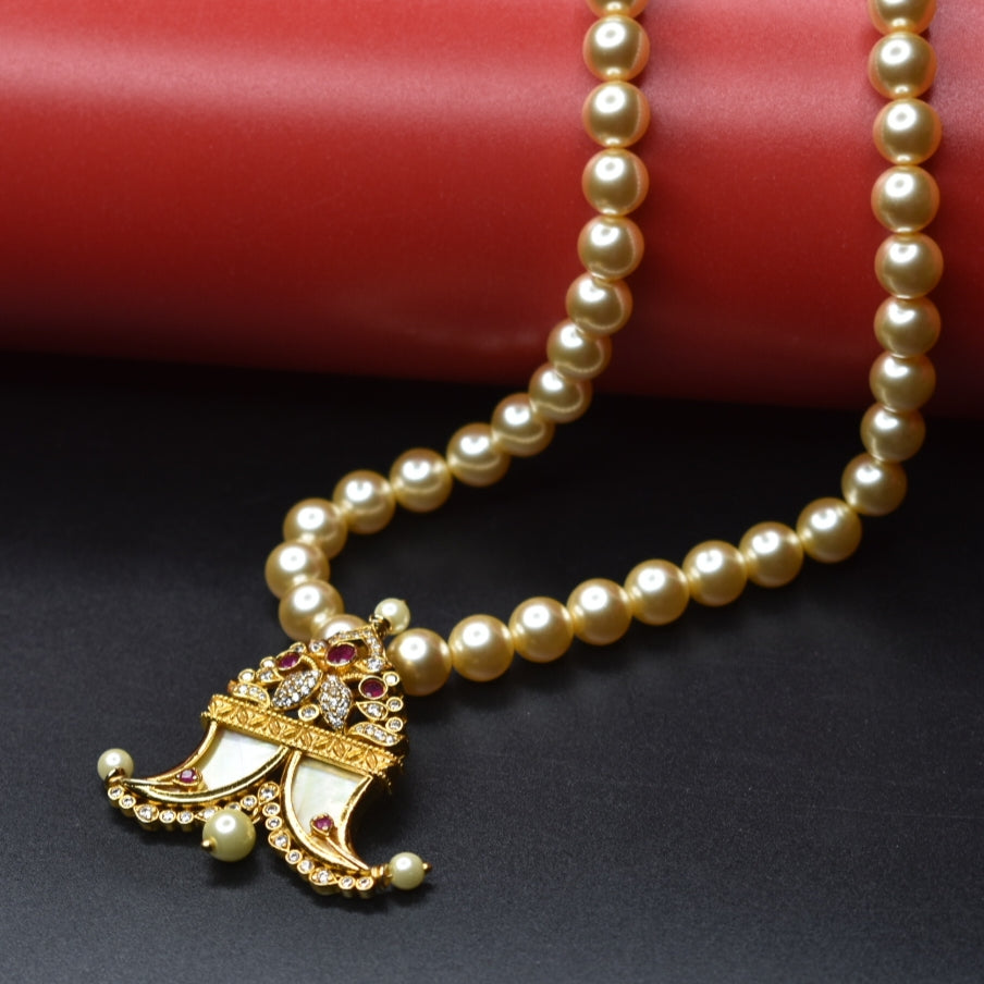 "Pearls of Elegance: Antique Finish Cz Puligoru Locket Necklace for Fashionable Kids"