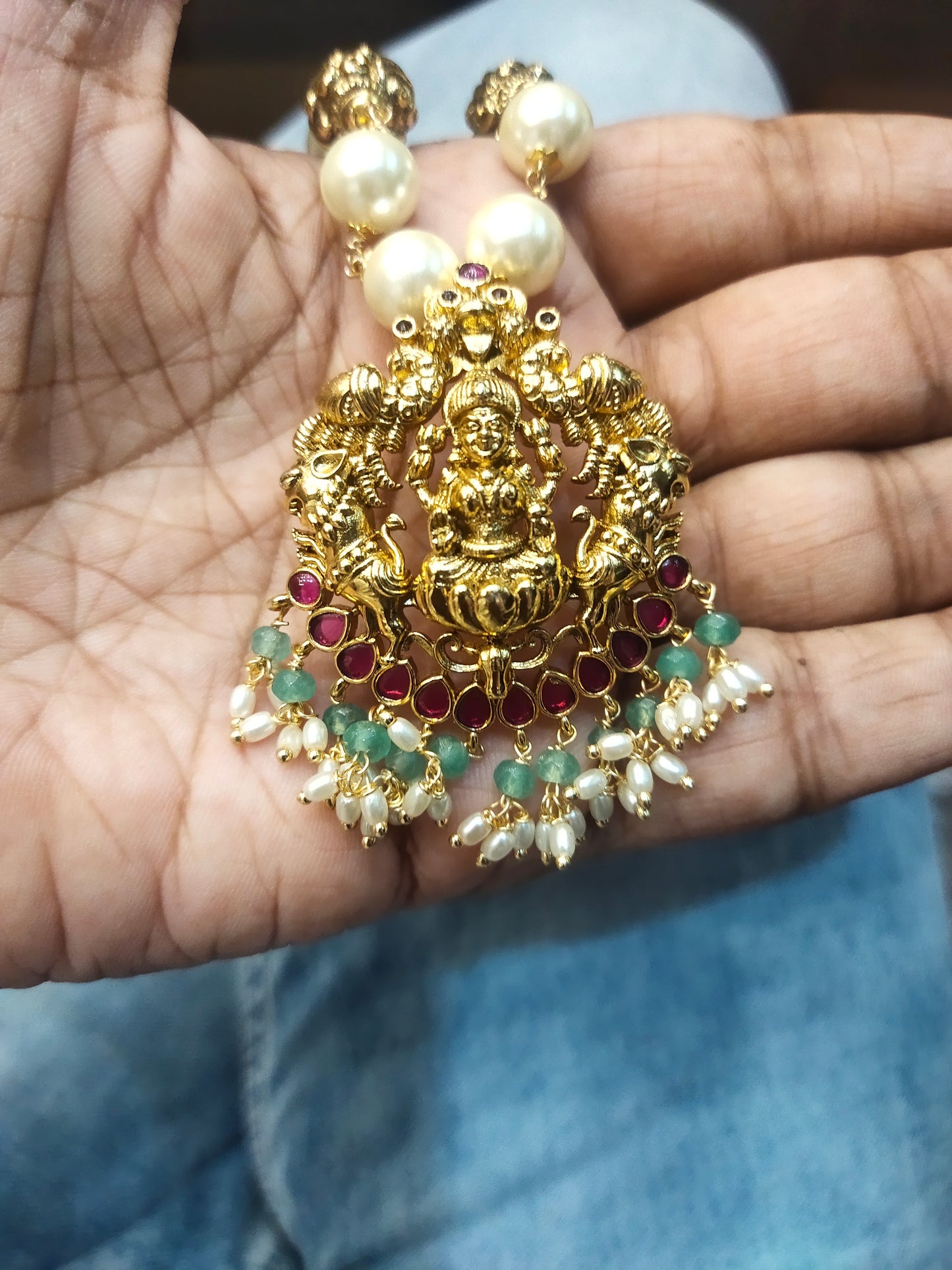 "Divine Elegance: Nagas Goddess Lakshmi Pendant Adorned with Pearl Chain"