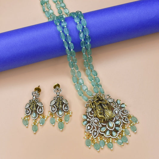 "Enchanting Elegance: The Pastel Green Radhakrishna Pendant Necklace - A Victorian-inspired Masterpiece with Beads Accents"