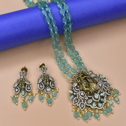 "Enchanting Elegance: The Pastel Green Radhakrishna Pendant Necklace - A Victorian-inspired Masterpiece with Beads Accents"