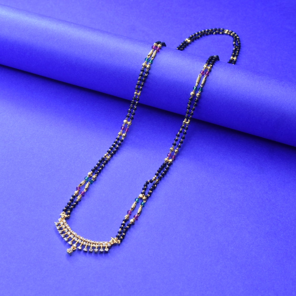 "Gleaming Elegance: The Exquisite Gold-Plated Mangalsutra Adorned with American Diamonds and Beads"