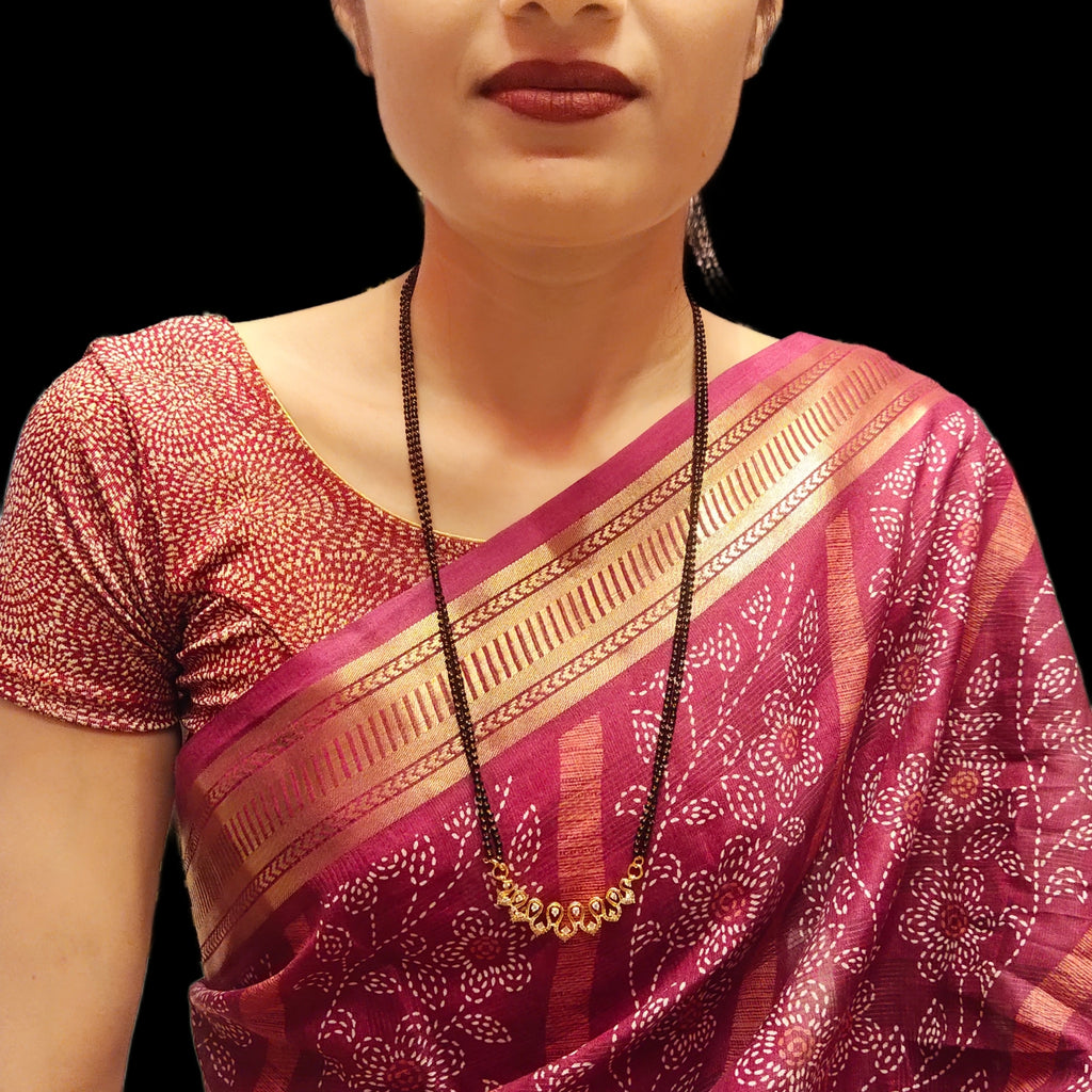 "Gleaming Elegance: The Exquisite Gold-Plated Mangalsutra Adorned with American Diamonds and Beads"