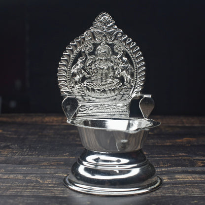 "Shine Bright: The Exquisite Pure Silver Kamakshi Deepam Set"