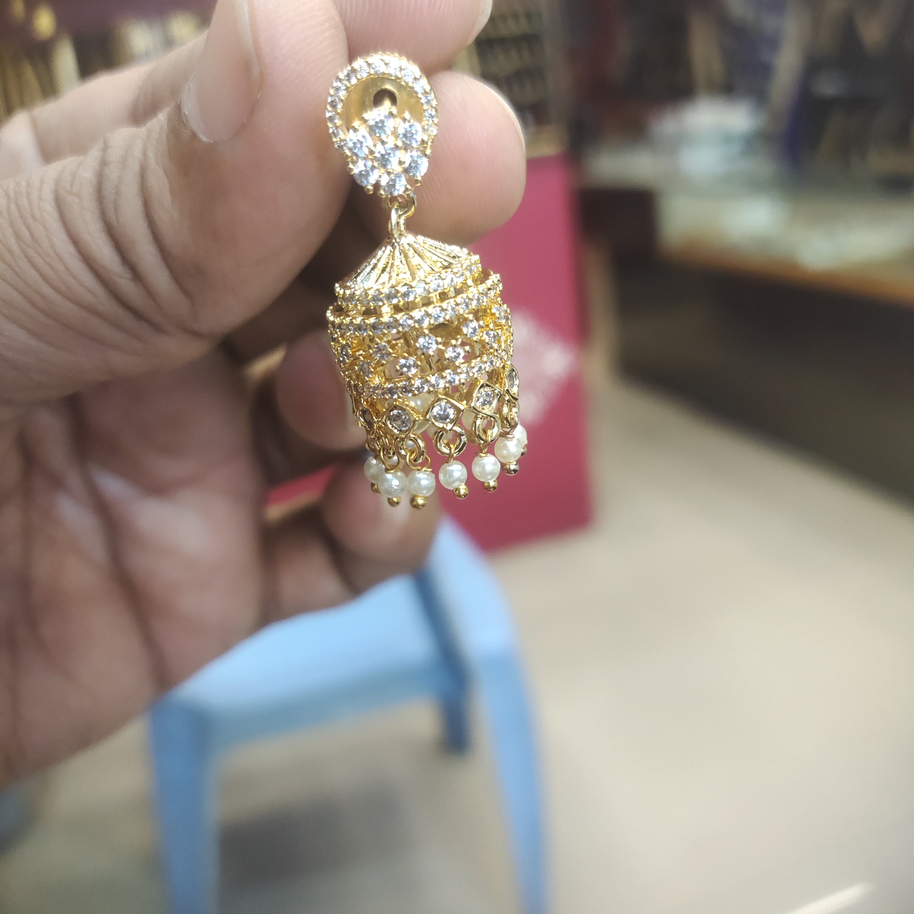 Ornate CZ Gold Plated Jhumka Earrings with Pearls