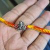 "Shimmering Blessings: 92.5 Silver Ganesh Rakhi - A Symbol of Divine Protection and Style"