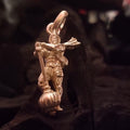 A silver pendant depicting the figure of Hanuman Ji holding a traditional weapon, the gada, in hand.