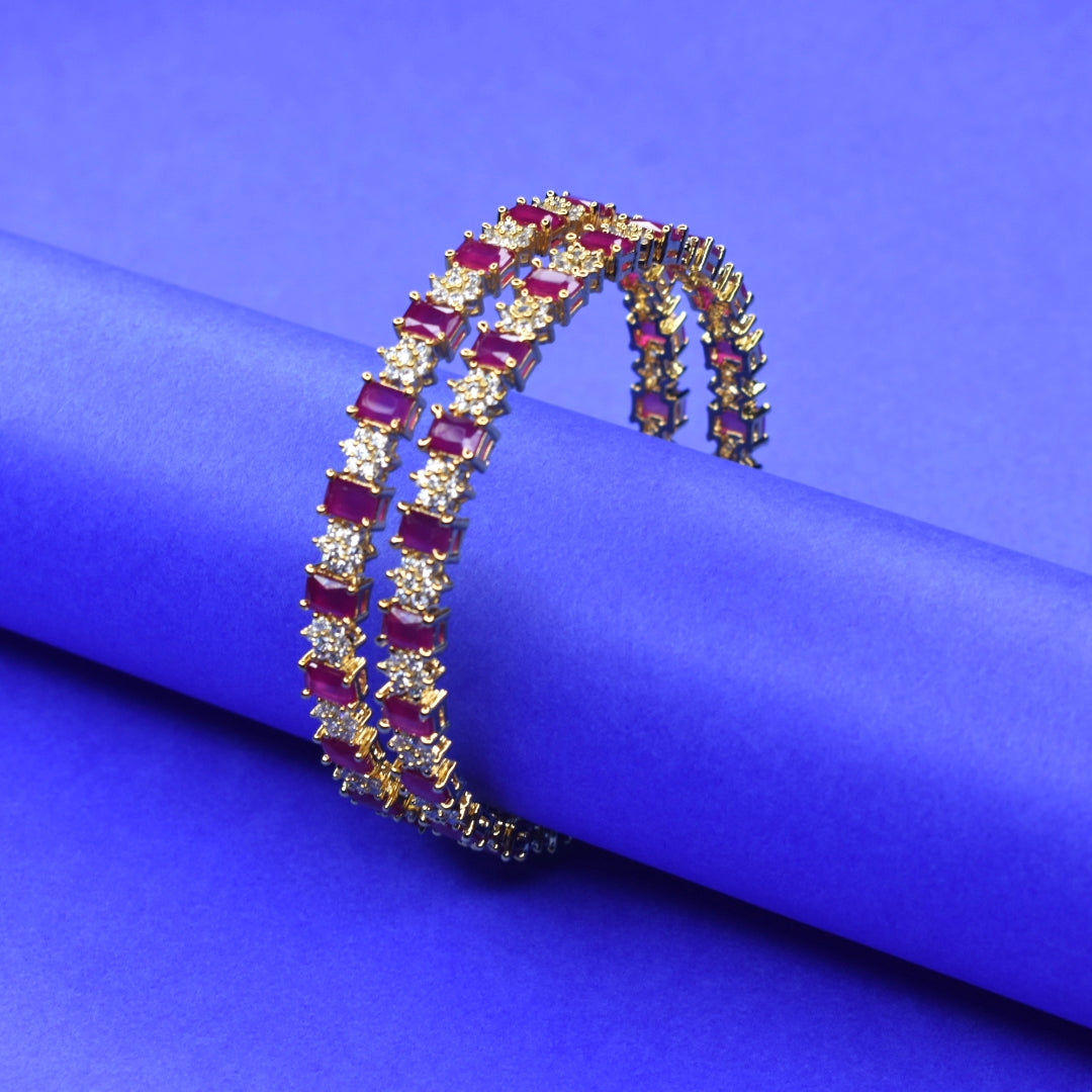 "Luxurious Elegance: Gold Plated Bangles Adorned with Rubies and American Diamonds"