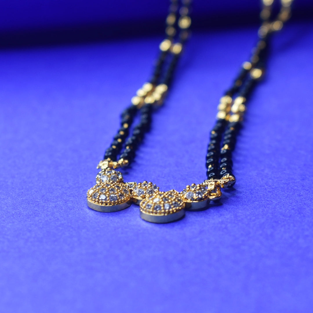 Gleaming Elegance: The Exquisite Gold-Plated 26 inches Mangalsutra Adorned with American Diamonds and Beads"