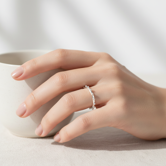 Silver Beaded Ring on Woman's Hand