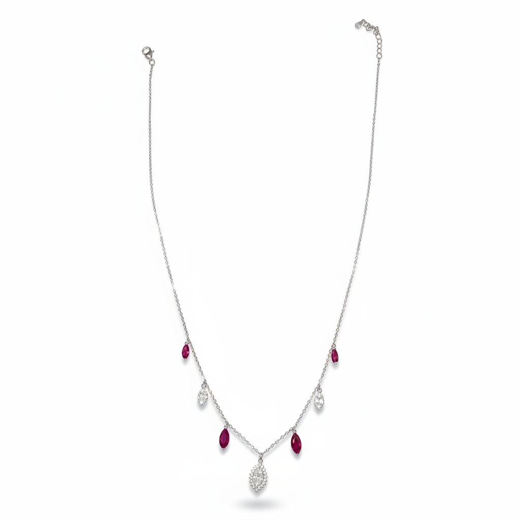 Silver necklace with ruby and crystal teardrops on white background