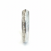 Silver temple bangle with Greek key pattern on white background