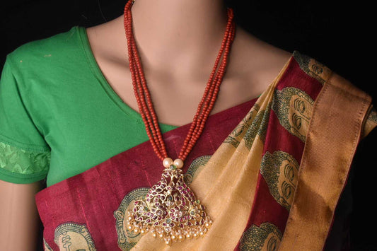Peacock shaped pendant with coral mala