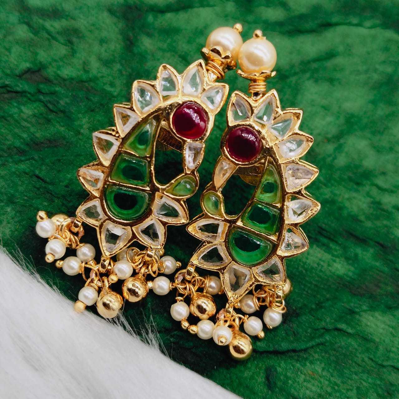 Buy Anika's Creations Peacock Shaped Traditional Brass Gold Plated White  Stone Studded Jhumka Earrings online